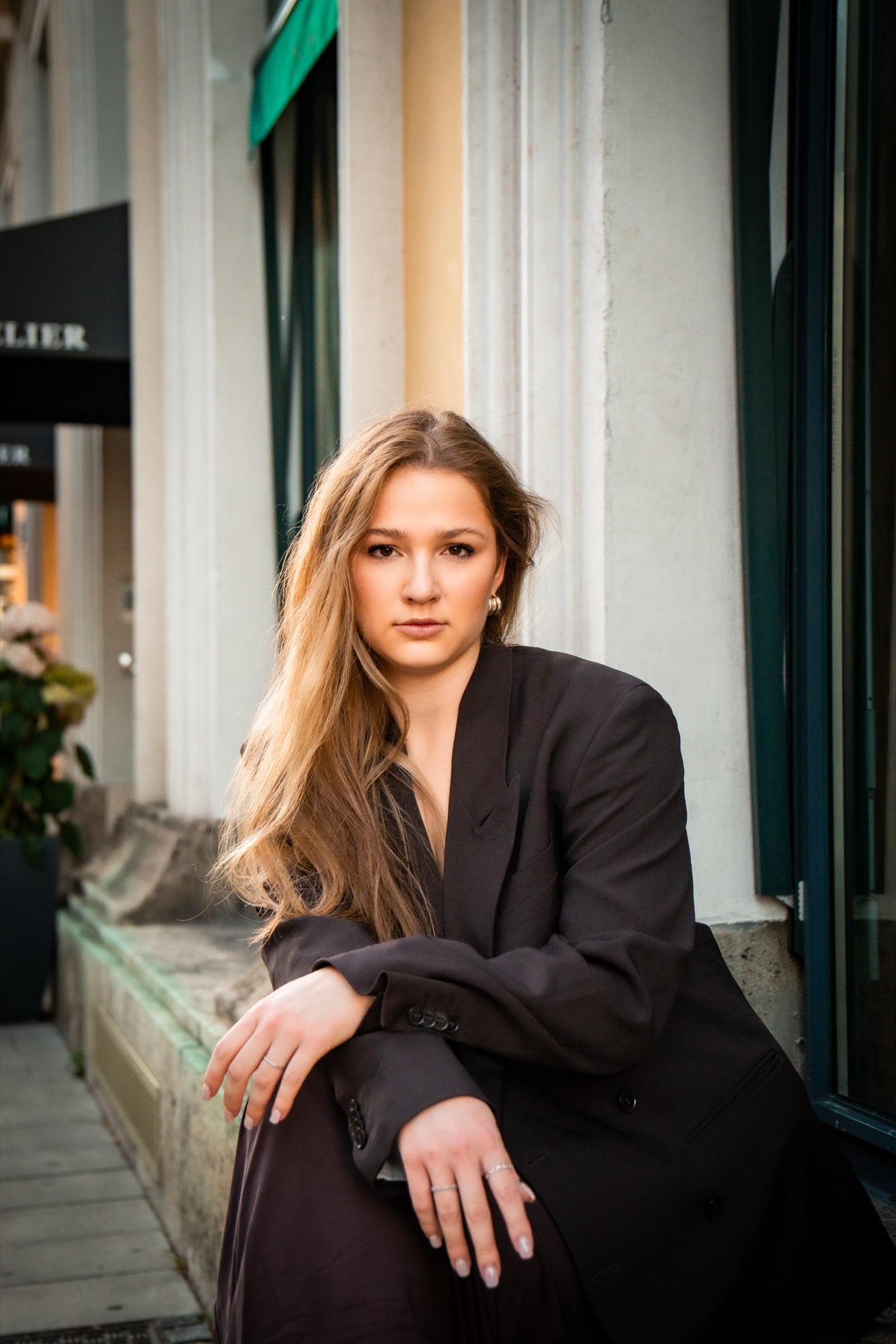 Editorial portrait on a stoop in oversized blazer