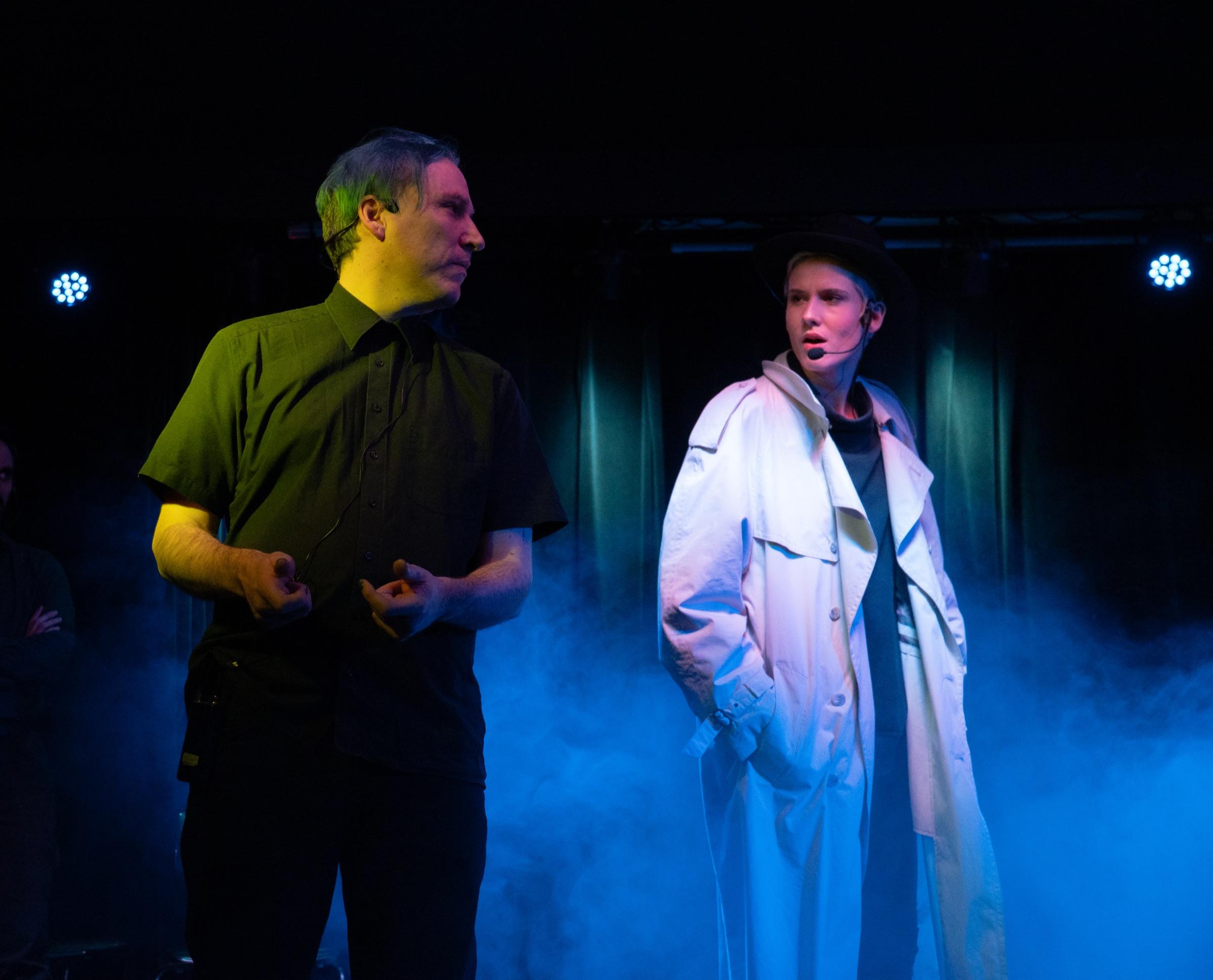 Two performers face off in a close improv scene