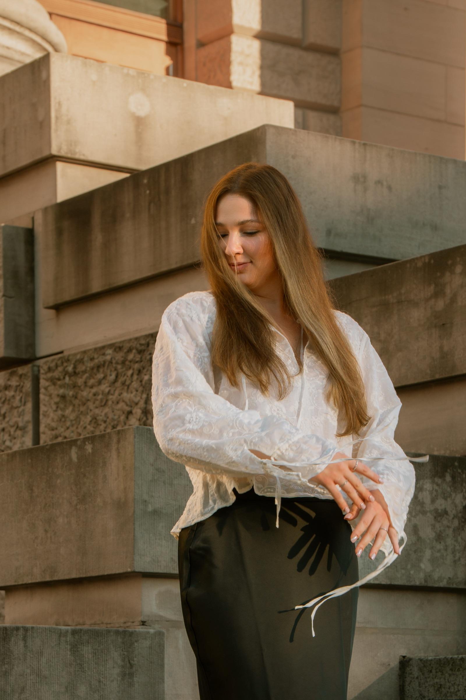 Portrait of a woman glancing downward in warm evening light