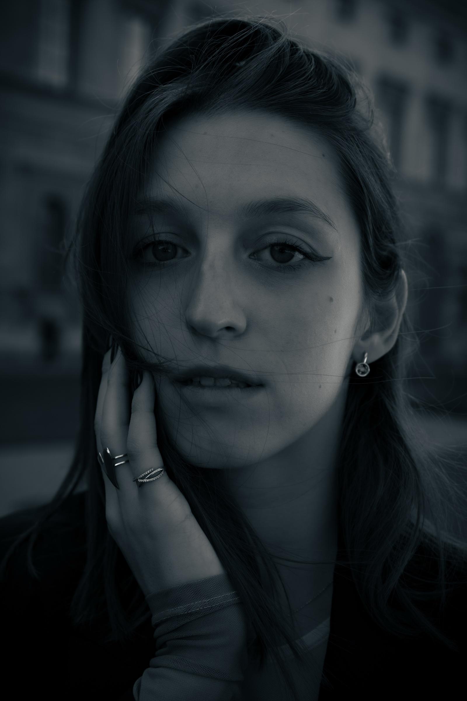 Black and white moody portrait through glass